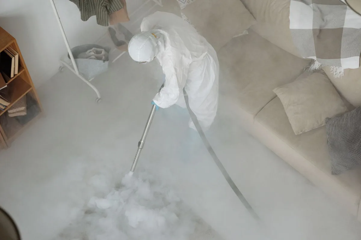 Biohazard cleanup technician in protective equipment, Wakefield-Peace Dale, RI